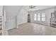 Upstairs living room with natural light, tile floors, and views to neighborhood at 2533 W Hazelwood St # 3, Phoenix, AZ 85017