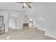 Open-concept living room with neutral color palette, tile flooring, and seamless flow to kitchen at 2533 W Hazelwood St # 3, Phoenix, AZ 85017