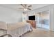 Comfortable main bedroom boasting sliding glass door access to the private patio at 2533 W Hazelwood St # 3, Phoenix, AZ 85017
