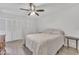 Serene main bedroom featuring tile flooring, ceiling fan, and closet with built-in shelving at 2533 W Hazelwood St # 3, Phoenix, AZ 85017