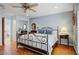 Bedroom with a metal framed bed and hardwood floors at 2631 E Beekman Pl, Phoenix, AZ 85016