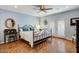 Bedroom with a metal framed bed and hardwood floors at 2631 E Beekman Pl, Phoenix, AZ 85016