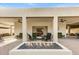 Covered patio area with comfortable seating and a fire feature at 2631 E Beekman Pl, Phoenix, AZ 85016