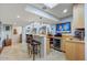 Wet bar with seating, wine storage, and mini-refrigerator at 2631 E Beekman Pl, Phoenix, AZ 85016