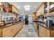 Long kitchen with granite counters, stainless steel appliances, and wood cabinets at 2631 E Beekman Pl, Phoenix, AZ 85016