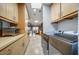 Laundry room with washer, dryer, and ample cabinet storage at 2631 E Beekman Pl, Phoenix, AZ 85016
