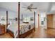 Main bedroom with a large four-poster bed and hardwood floors at 2631 E Beekman Pl, Phoenix, AZ 85016