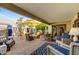 Relaxing patio with seating area, umbrella, and brick flooring at 2631 E Beekman Pl, Phoenix, AZ 85016