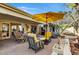 Outdoor patio space featuring seating, a grill, and yellow umbrella at 2631 E Beekman Pl, Phoenix, AZ 85016