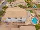 Aerial view of a home featuring a private backyard with a pool, fire pit, and lush landscaping at 3241 E Aris Dr, Gilbert, AZ 85298