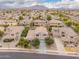 Neighborhood aerial view of a landscaped community and mountain backdrop at 3241 E Aris Dr, Gilbert, AZ 85298