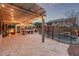 Outdoor patio area with a built-in grill, and a gated pool, perfect for entertaining at 3241 E Aris Dr, Gilbert, AZ 85298