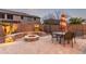 Inviting outdoor living with paver patio, fire pit, built-in seating, and pool in a private, walled yard at 3241 E Aris Dr, Gilbert, AZ 85298