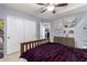 Bright bedroom featuring a full-size bed, dresser, and shelving at 3241 E Aris Dr, Gilbert, AZ 85298