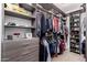 Custom closet with built-in shelving, drawers, and hanging space offers ample storage at 3241 E Aris Dr, Gilbert, AZ 85298