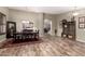 Dining room featuring wood floors, dark wood table set, and view into the living area at 3241 E Aris Dr, Gilbert, AZ 85298