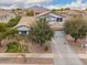 Charming two-story home with a well-manicured lawn and beautiful trees at 3241 E Aris Dr, Gilbert, AZ 85298