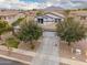 Charming two-story home with a well-manicured lawn and beautiful trees at 3241 E Aris Dr, Gilbert, AZ 85298