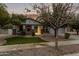 Charming single-Gathering home featuring stone accents, a well-kept lawn, and a welcoming front porch at 3241 E Aris Dr, Gilbert, AZ 85298