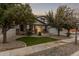 Inviting single-Gathering home with a manicured lawn and desert landscaping in a peaceful neighborhood at 3241 E Aris Dr, Gilbert, AZ 85298