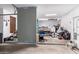 Spacious garage featuring a workbench and ample storage for tools and equipment at 3241 E Aris Dr, Gilbert, AZ 85298