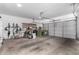 Organized garage with ample storage, work bench, and space for multiple vehicles at 3241 E Aris Dr, Gilbert, AZ 85298
