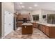 Open kitchen featuring a large central island, stainless steel appliances, and tile backsplash at 3241 E Aris Dr, Gilbert, AZ 85298
