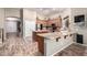 Spacious kitchen featuring custom cabinetry, granite countertops, and a convenient center island with breakfast bar at 3241 E Aris Dr, Gilbert, AZ 85298