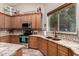 Kitchen featuring granite countertops, stainless appliances, tile backsplash, and window over the sink at 3241 E Aris Dr, Gilbert, AZ 85298