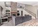 Open-concept living area with stone fireplace, built-in shelves, and a staircase at 3241 E Aris Dr, Gilbert, AZ 85298
