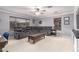 Spacious living room features a large sectional, ceiling fan, and neutral carpet at 3241 E Aris Dr, Gilbert, AZ 85298
