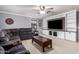 Comfortable living room offers built-in shelving, a ceiling fan, and a large sectional sofa at 3241 E Aris Dr, Gilbert, AZ 85298