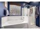 Main bathroom featuring a garden tub and glass-enclosed shower at 3241 E Aris Dr, Gilbert, AZ 85298