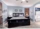 Inviting main bedroom with dark wood furniture and serene blue walls at 3241 E Aris Dr, Gilbert, AZ 85298
