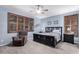 Comfortable main bedroom featuring a ceiling fan, shutters and lounge chair at 3241 E Aris Dr, Gilbert, AZ 85298