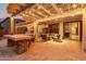Cozy outdoor patio featuring pergola, string lights, comfortable seating, and seamless indoor-outdoor transition at 3241 E Aris Dr, Gilbert, AZ 85298