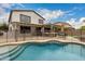 Inviting backyard featuring a private pool, covered patio, and outdoor seating, ideal for relaxing and entertaining at 3241 E Aris Dr, Gilbert, AZ 85298