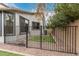 Fenced side yard with artificial turf, providing a safe and low-maintenance outdoor space at 3241 E Aris Dr, Gilbert, AZ 85298