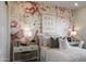 Charming bedroom with floral wall mural, cozy bedding, and stylish nightstands at 33608 N Maverick Mountain Trl, San Tan Valley, AZ 85144