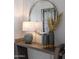 Modern entryway console table with lamps and decorative vases at 33608 N Maverick Mountain Trl, San Tan Valley, AZ 85144