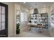Bright home office with built-in shelving and window seat at 33608 N Maverick Mountain Trl, San Tan Valley, AZ 85144
