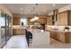 Spacious kitchen with an island, stainless steel appliances, and light wood cabinets at 33608 N Maverick Mountain Trl, San Tan Valley, AZ 85144