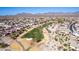 Aerial view of homes near a golf course, showcasing a desert setting at 514 S 224Th Dr, Buckeye, AZ 85326