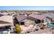 Aerial view showcasing a home's backyard oasis, complete with a pool and patio furniture at 514 S 224Th Dr, Buckeye, AZ 85326