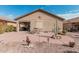 Backyard with patio, seating, and desert landscaping at 514 S 224Th Dr, Buckeye, AZ 85326