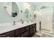 Elegant bathroom with double vanity, large shower, and soothing color scheme at 514 S 224Th Dr, Buckeye, AZ 85326
