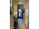 Inviting entryway with a decorative security door and light tile flooring, creating a warm welcome at 514 S 224Th Dr, Buckeye, AZ 85326