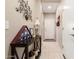 Bright and spacious entryway with tile flooring and console table at 514 S 224Th Dr, Buckeye, AZ 85326