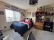 Bright bedroom with double bed, built-in shelving and window at 515 S Parkcrest -- # 531, Mesa, AZ 85206