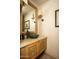 Charming bathroom vanity features a green vessel sink and a decorative wood cabinet at 5526 E Roadrunner Rd, Paradise Valley, AZ 85253